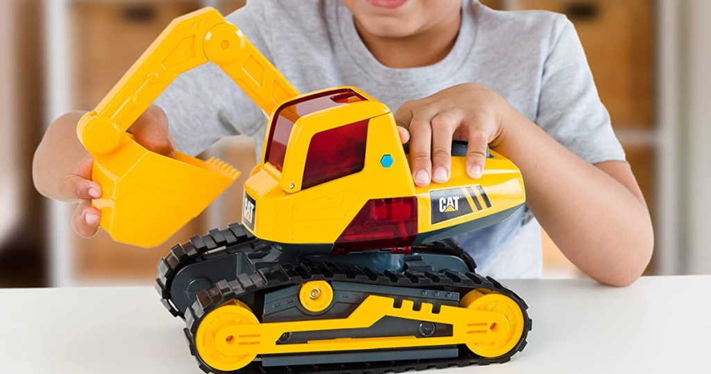 boy with excavator toy