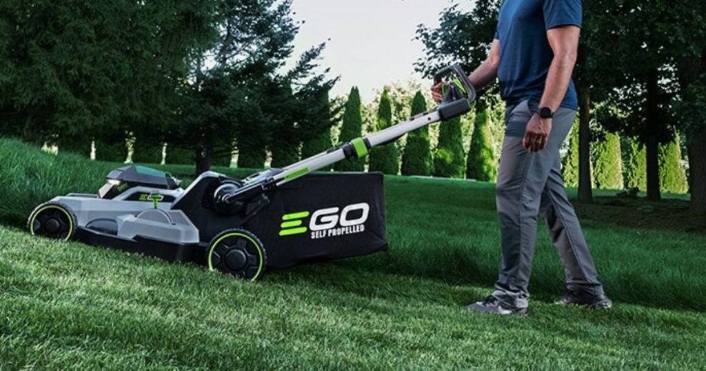 man mowing lawn with EGO mower