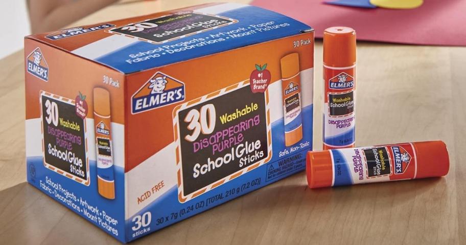 Elmer's Disappearing Purple School Glue Sticks 30-Pack on desk