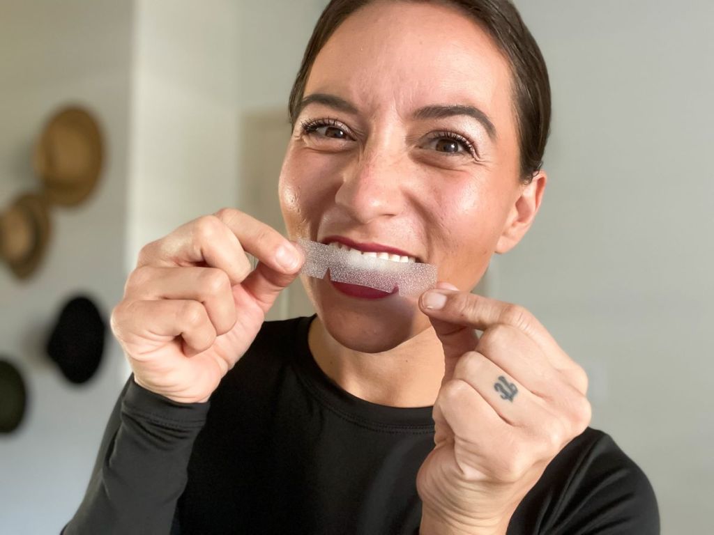 woman holding Fairywill Whitening Strips