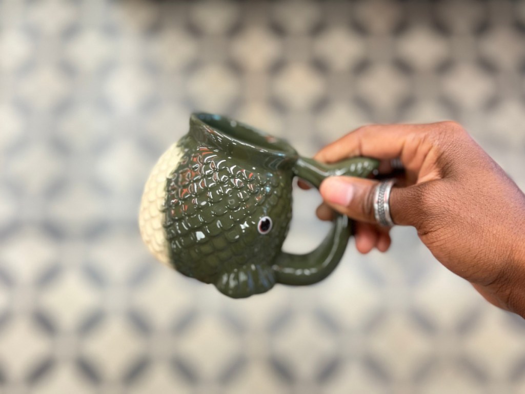 green and white fish mug