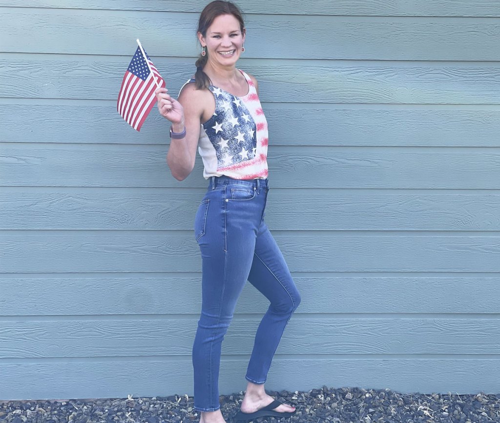 woman in good american jeans and american flag tank