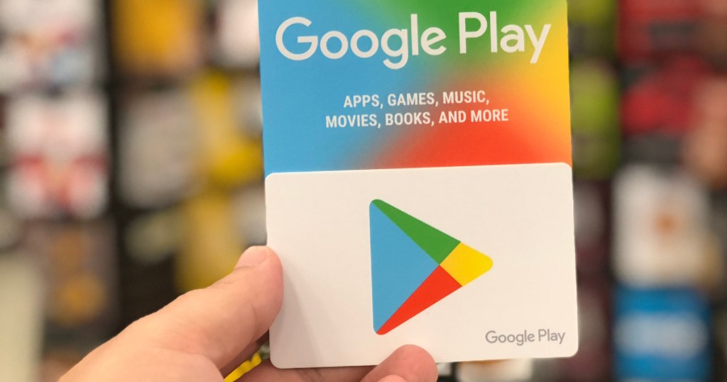 Hand holding google play gift card