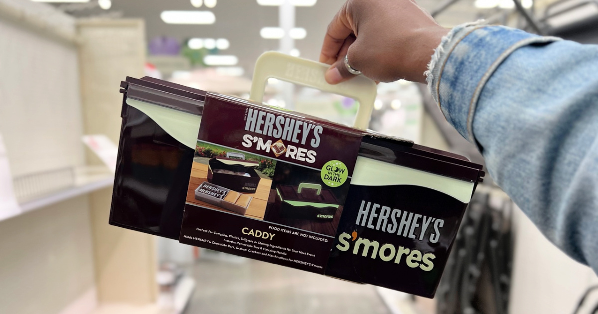 woman holding a Hershey's Glow in the Dark S'mores Caddy