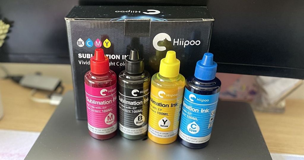 4 Hipoo Sublimation Ink Refills jars in front of packaging