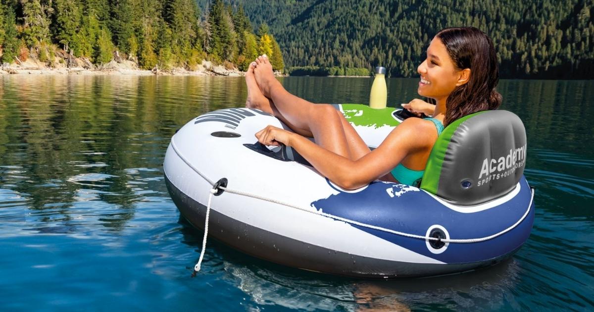 woman in Intex River Run Inflatable Tube going down a river surrounded by mountains and trees