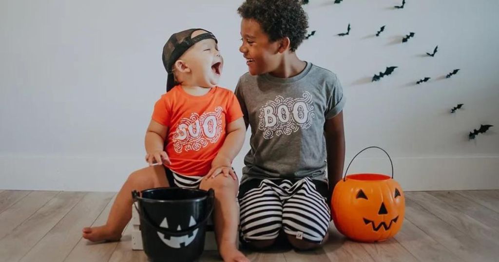 two kids in Halloween shirts