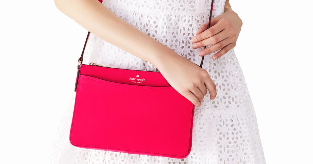 woman with bright pink kate spade crossbody