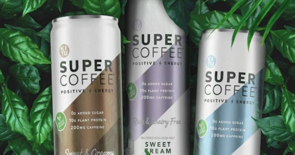 three cans of coffee in leaves