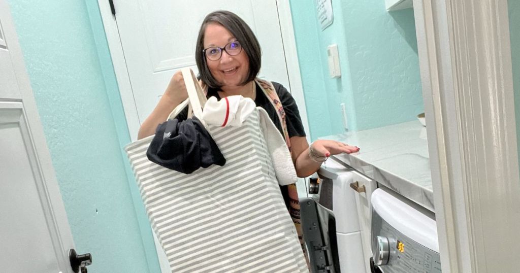 woman holding a laundry hamper