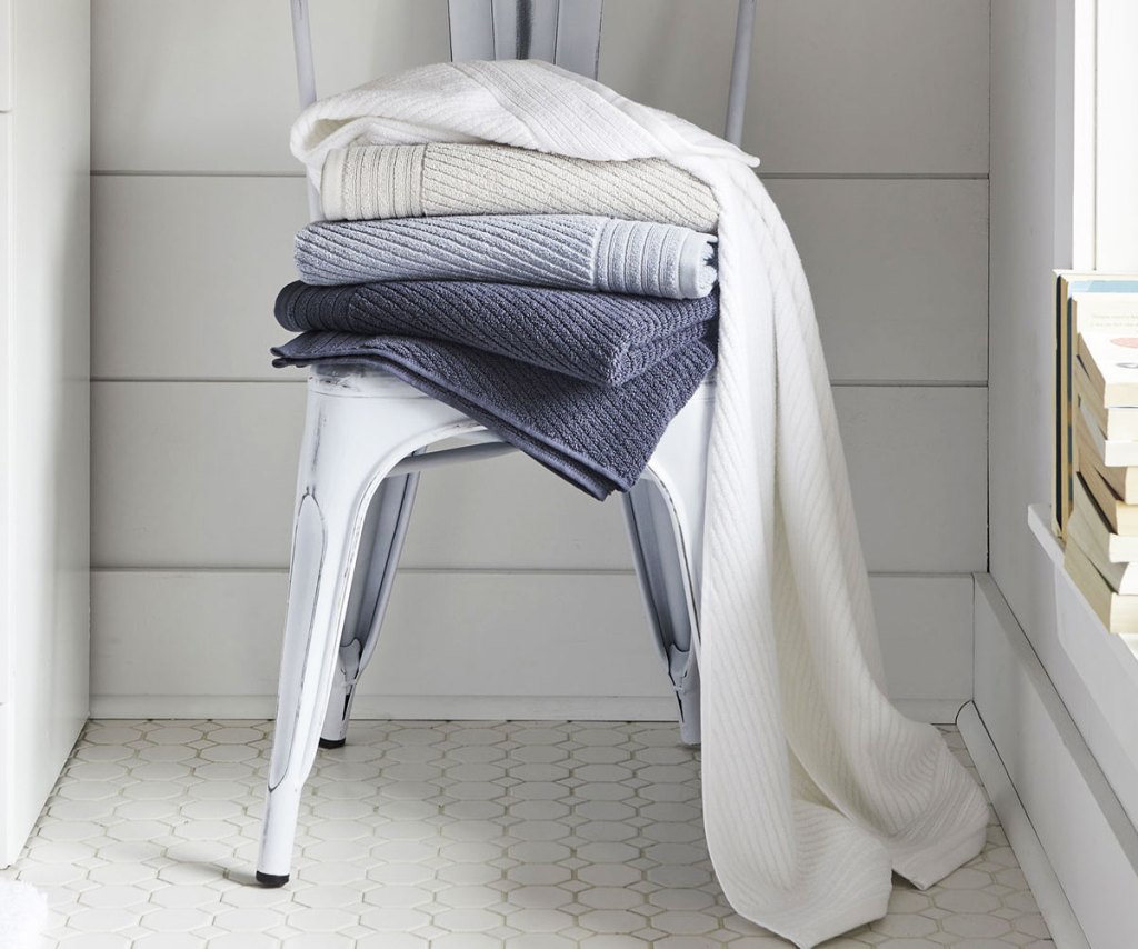 folded bath towels on chair
