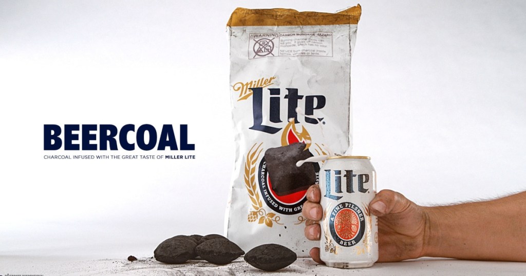 holding a can of Miller Lite in front of a bag of beer infused charcoal