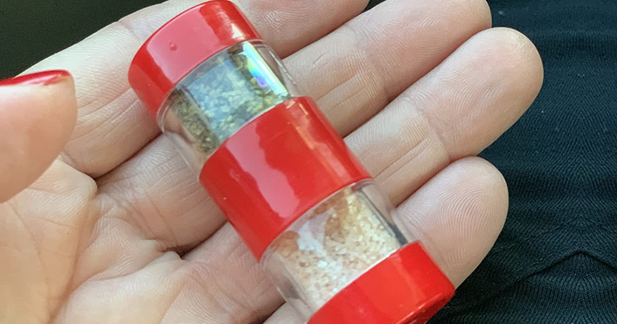 Mini salt and pepper shaker in hand