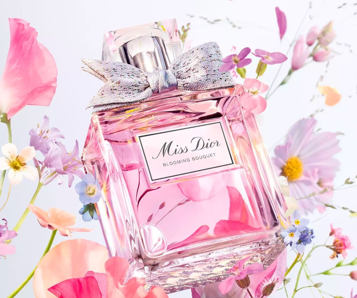 Miss Dior Blooming Bouquet Eau de Toilette bottle on a background of flowers