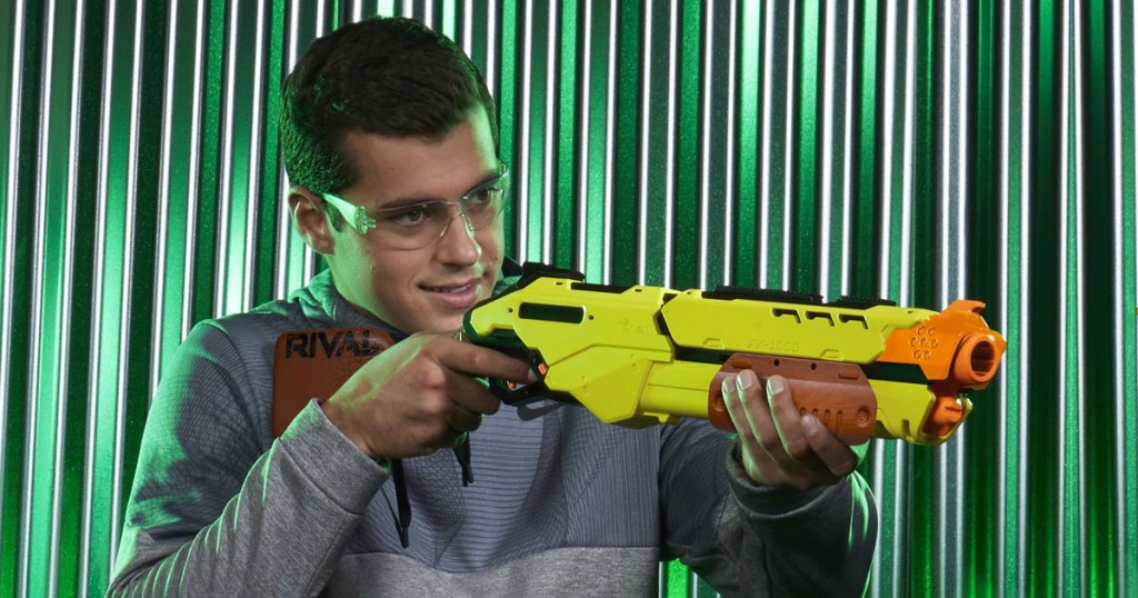 teen boy holding nerf blaster