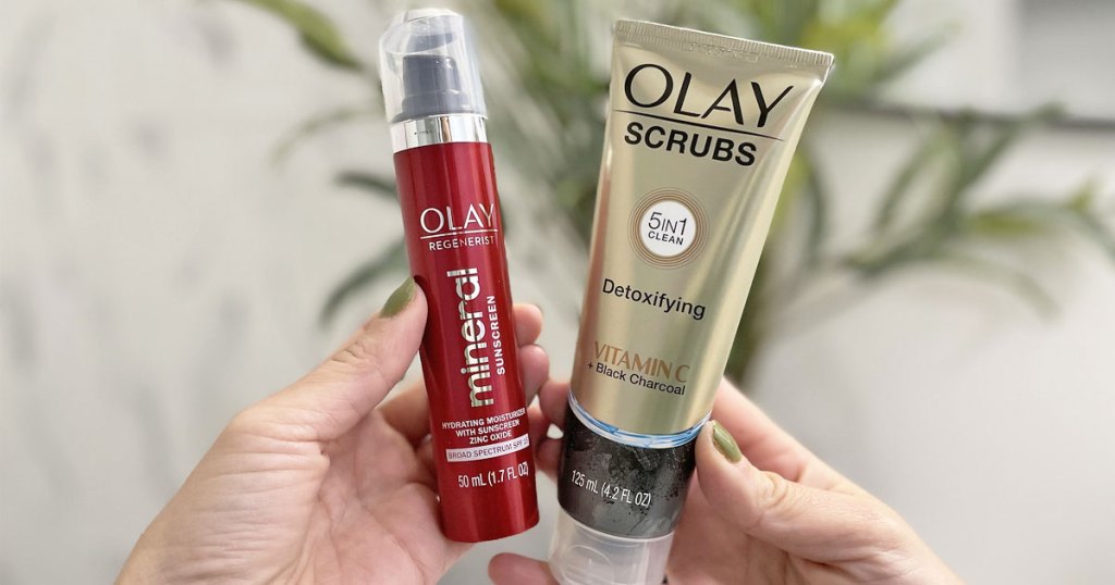hands holding Olay Detoxifying Face Scrub & Mineral Sunscreen