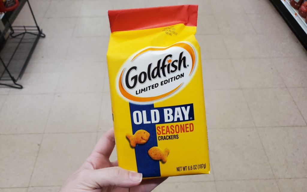 Hand holding a bag of Old Bay Goldfish Crackers