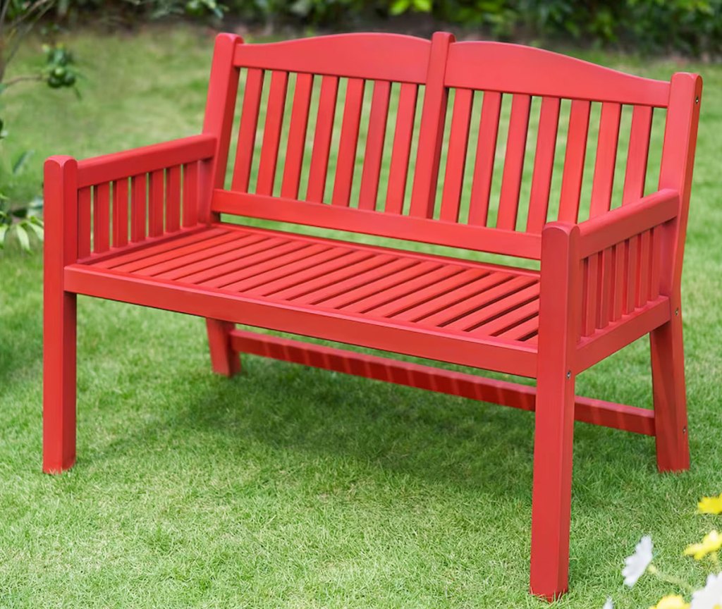 red bench in grass