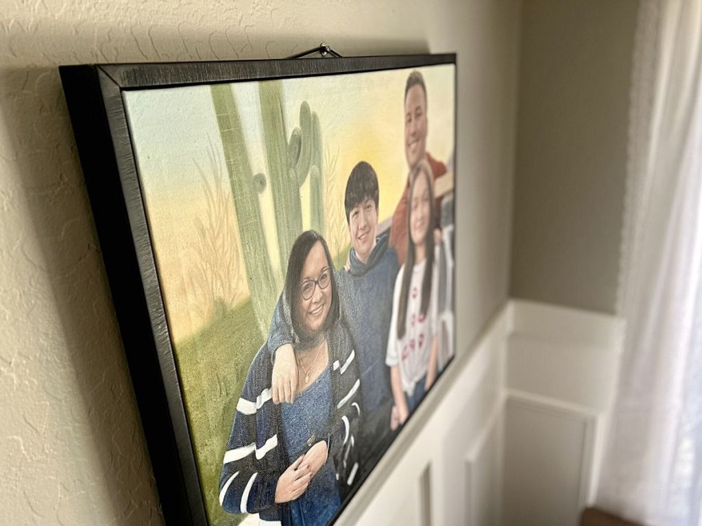 oil painting of family on wall in living room