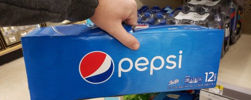 Hand holding Pepsi 12-pack