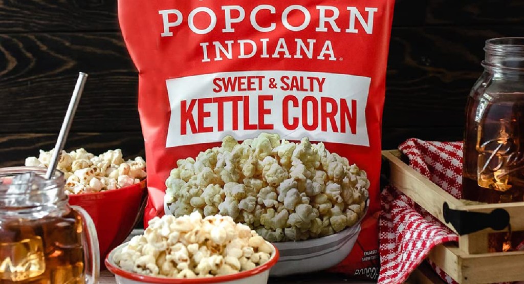 Popcorn Indiana Kettle Corn King Size Bags 6 Count displayed with ice tea around
