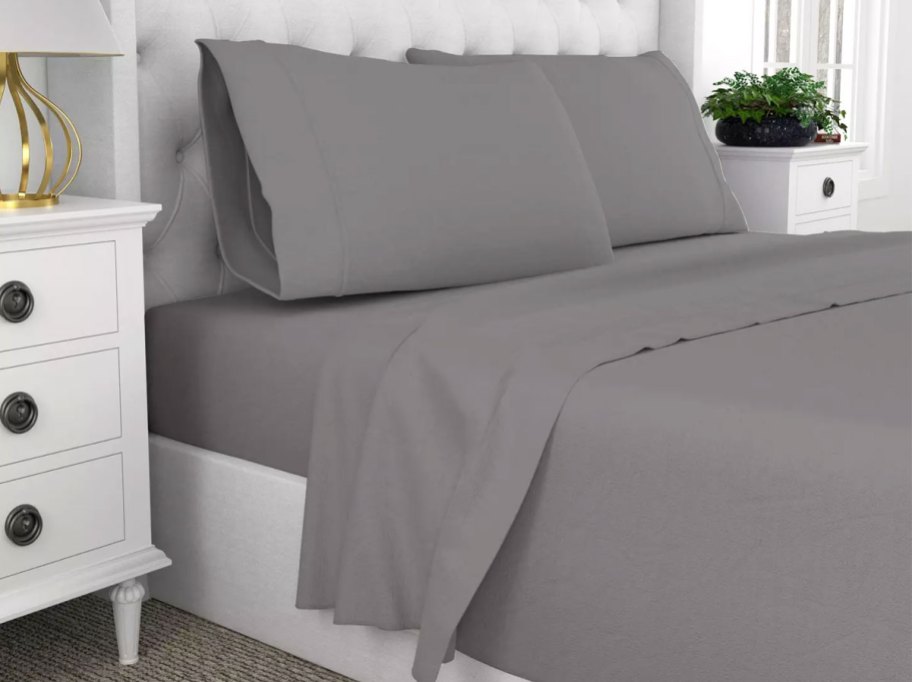grey sheets on bed