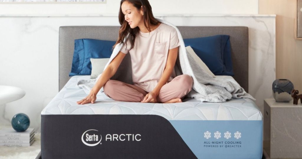woman sitting on a Serta mattress