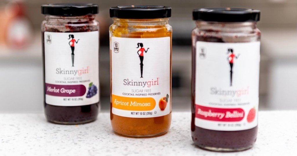 three jars of sugar-free fruit preserves in different flavors