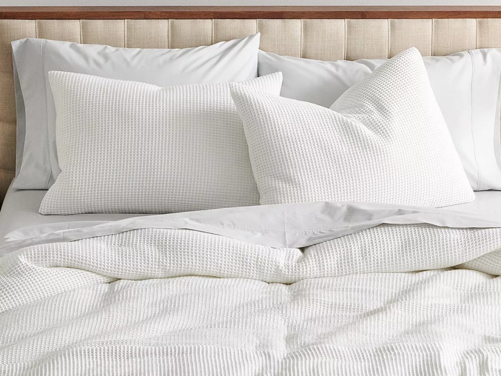 white waffle pattern bedding set on bed