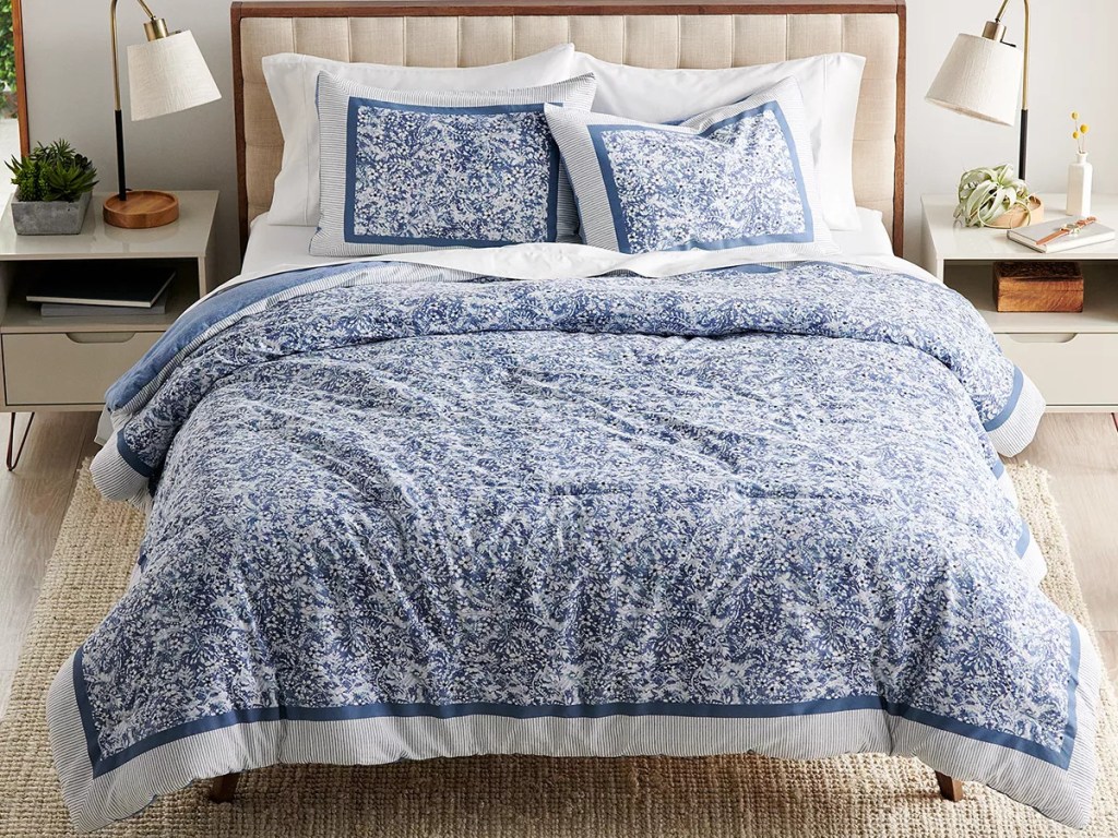 blue floral bedding set on bed