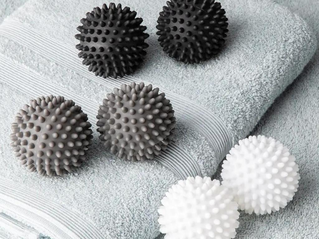 woolite dryer balls in gray, black, and white