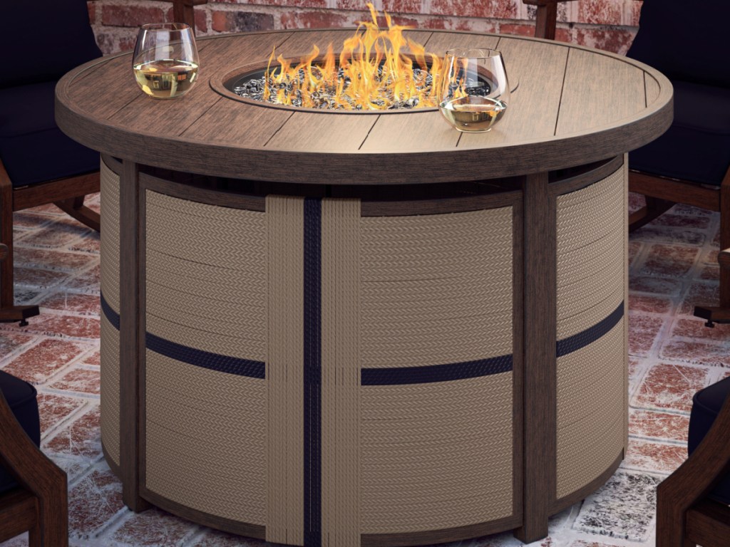 brown fire pit table on patio