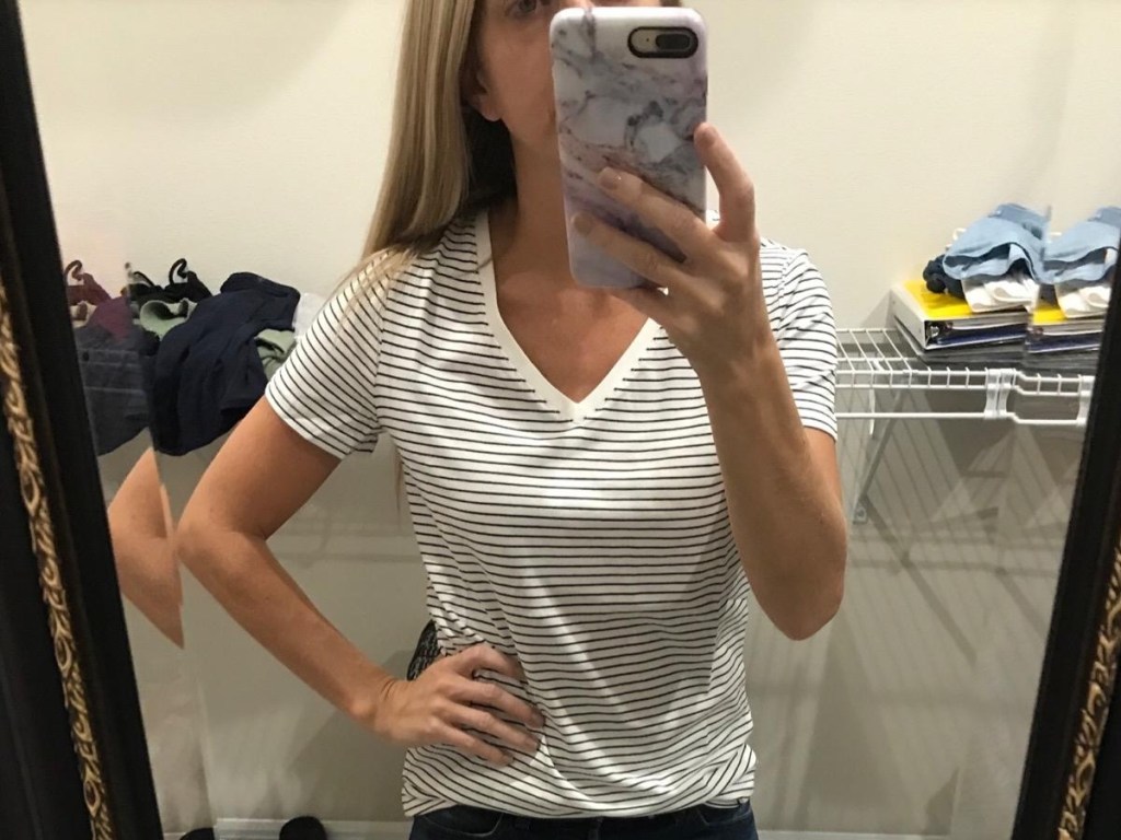 woman taking selfie in walk-in closet