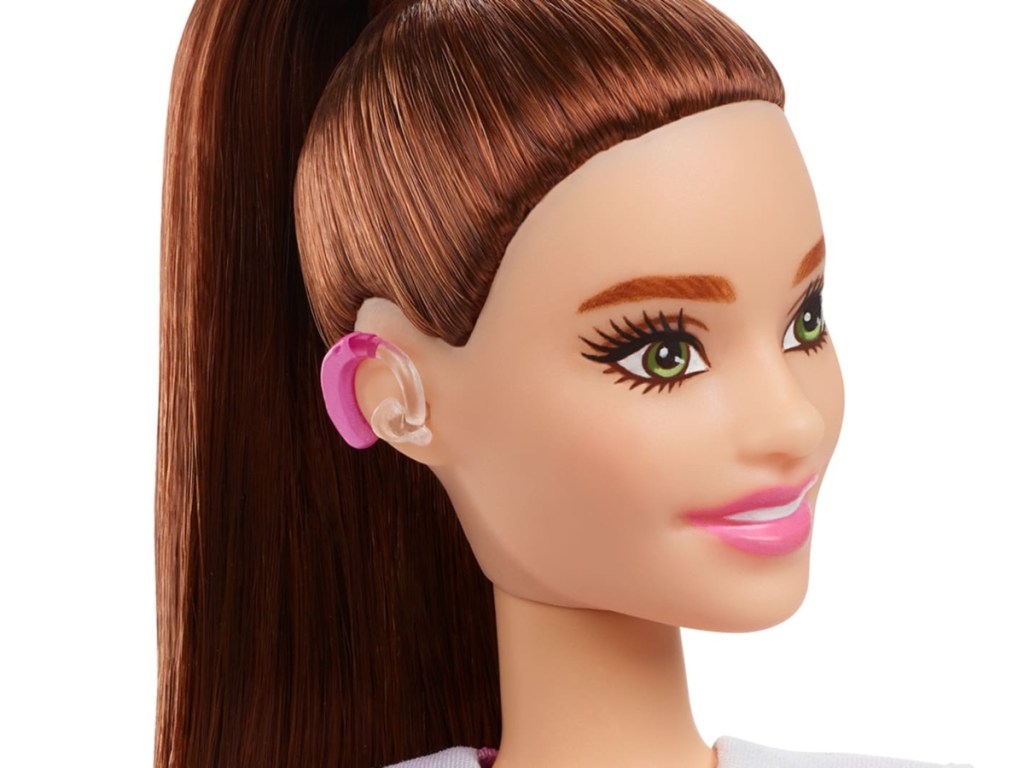 Barbie doll with brown ponytail and hearing aids
