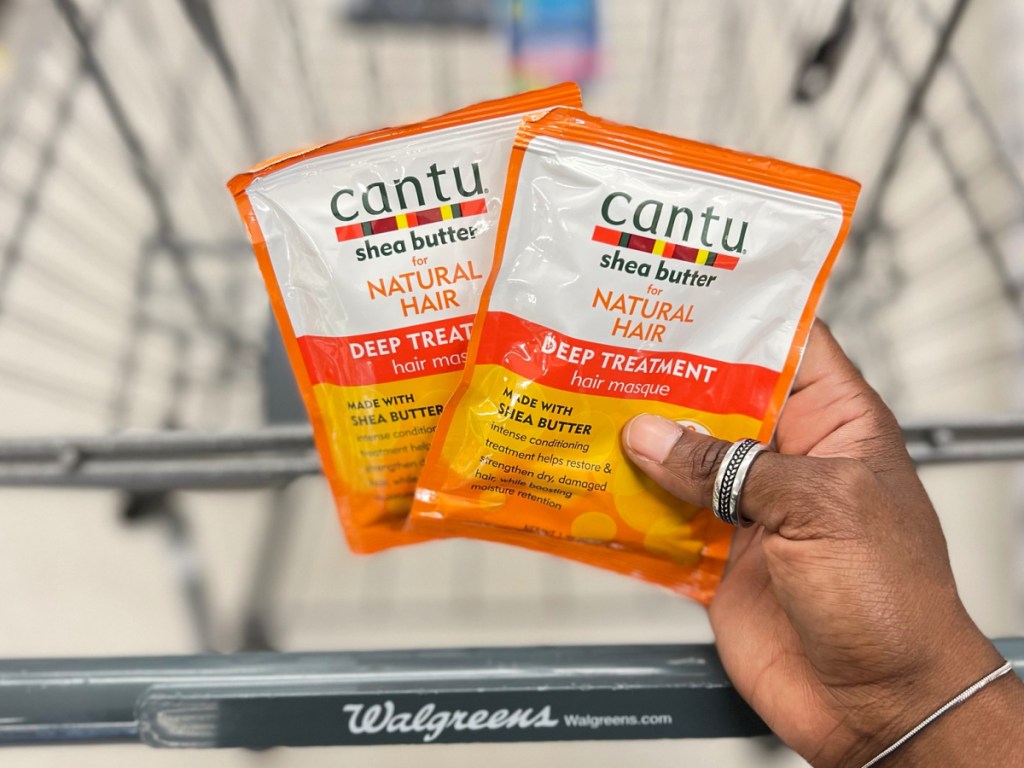 cantu deep treatment mask being held up by hand