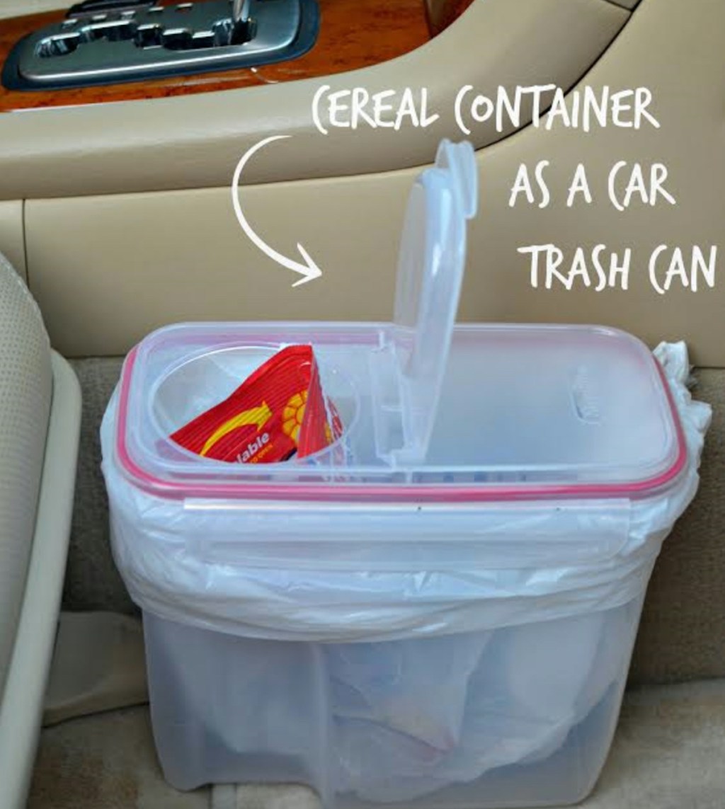 clear cereal container on floor of car being used as a trash can