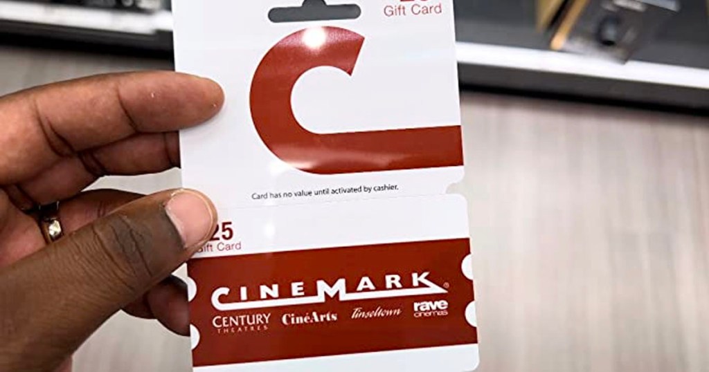 hand holding cinemark gift card