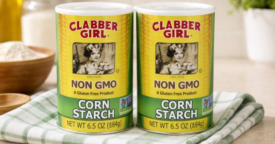2 canisters of Clabber Girl corn starch on a dish towel