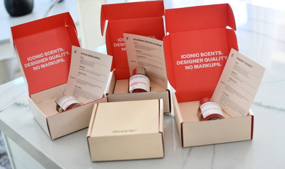 dossier perfume in their boxes