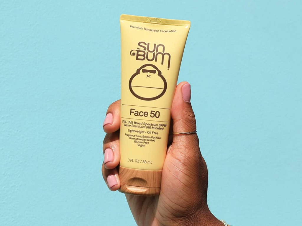 hand holding Sun Bum Original SPF 50 Sunscreen Face Lotion