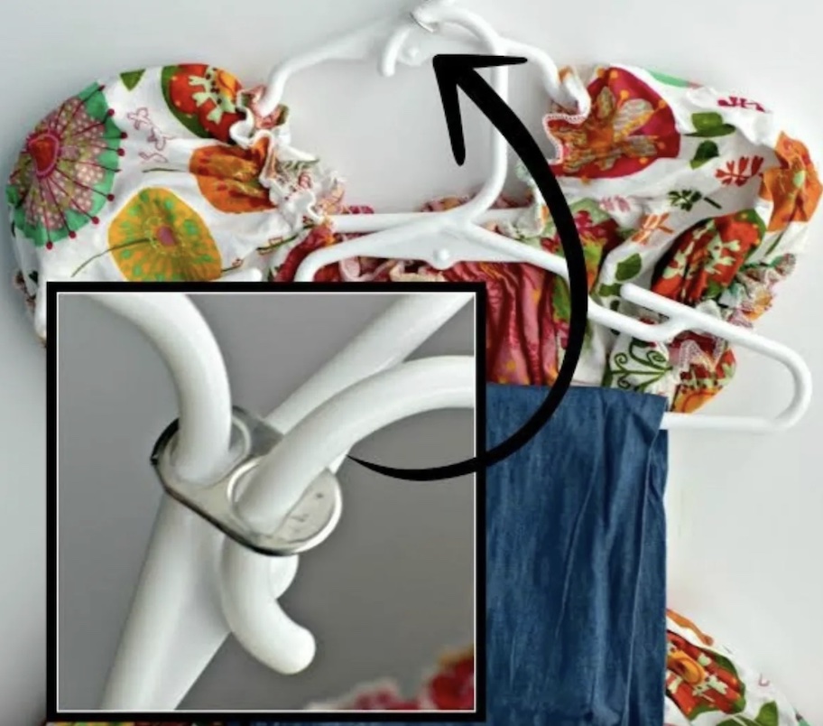 white hangers with clothes