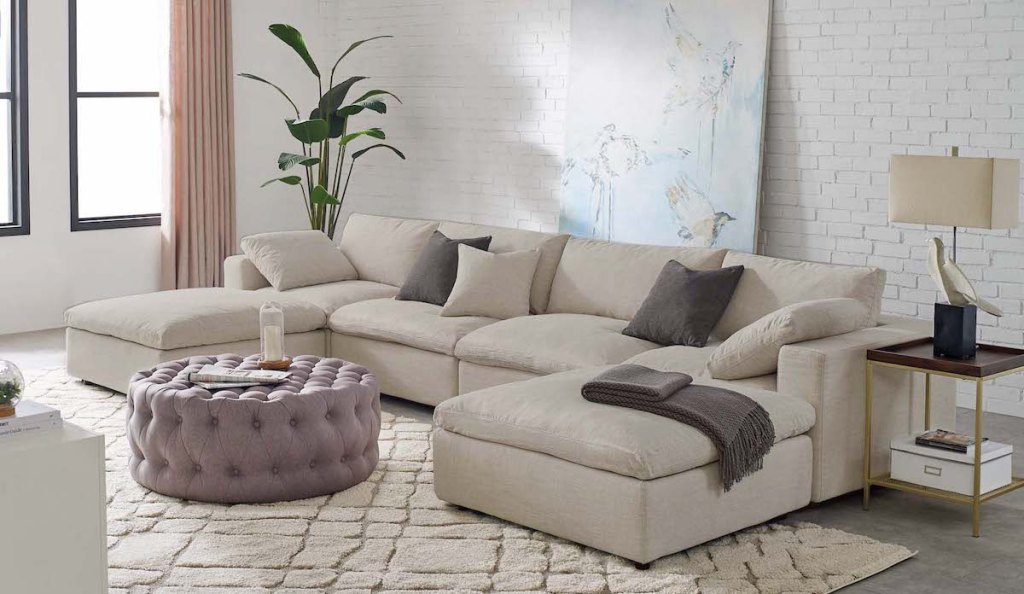 beige colored sectional in living room showroom