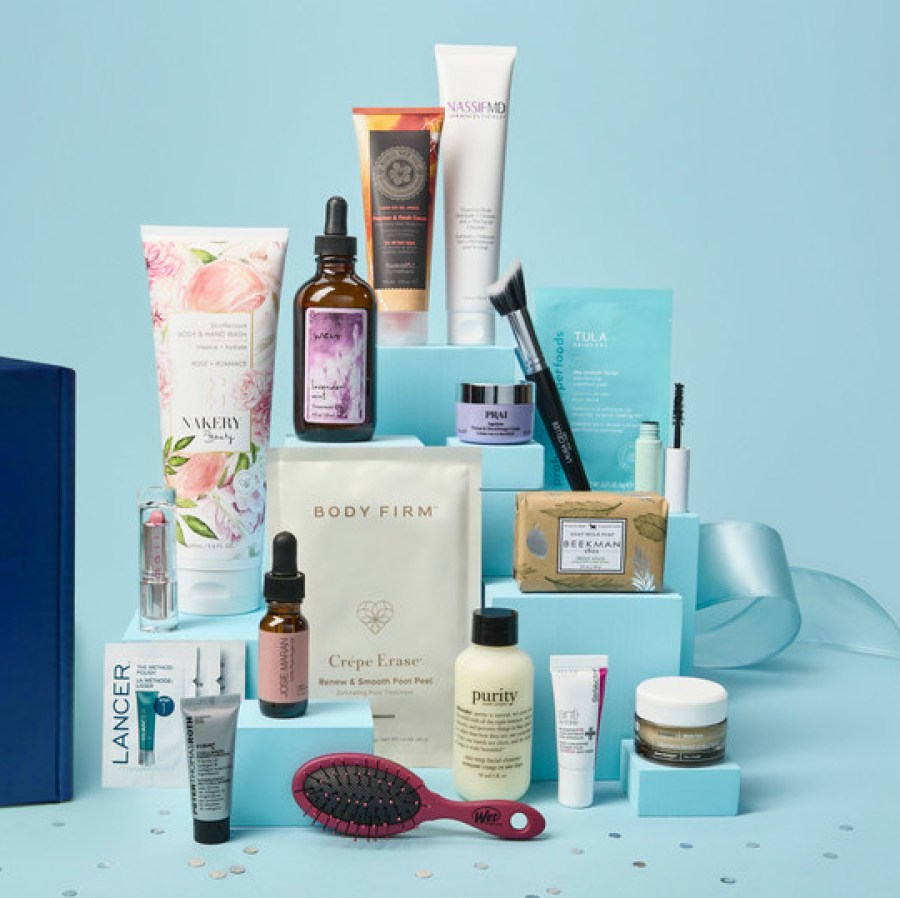 collection of beauty items stacked against a light blue background