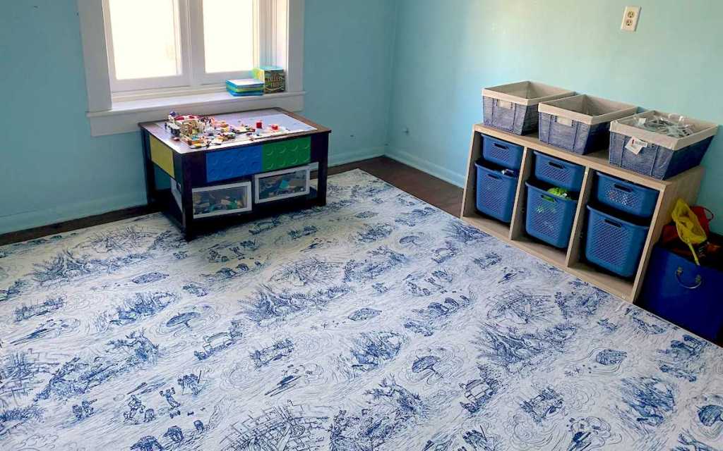 white and blue country style rug in kids playroom