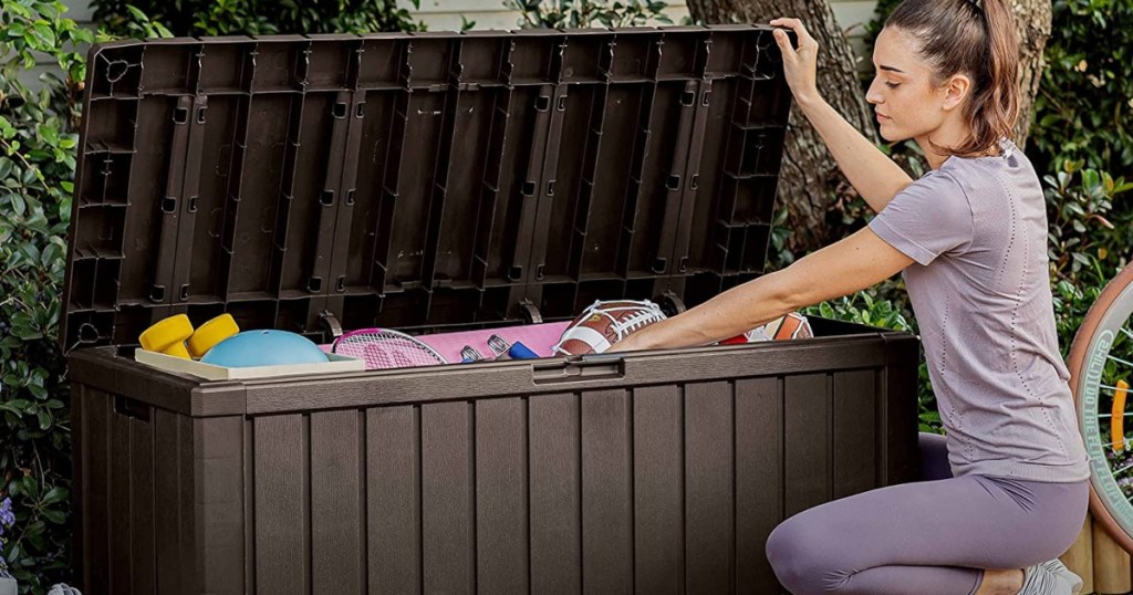 woman opening outdoor storage box