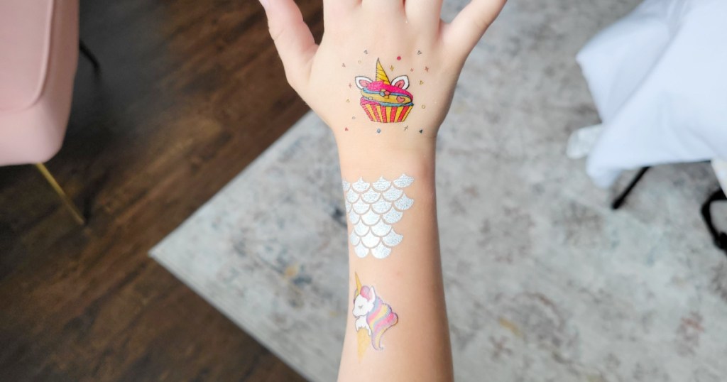 konsait temporary tattoos on a young girl's arm