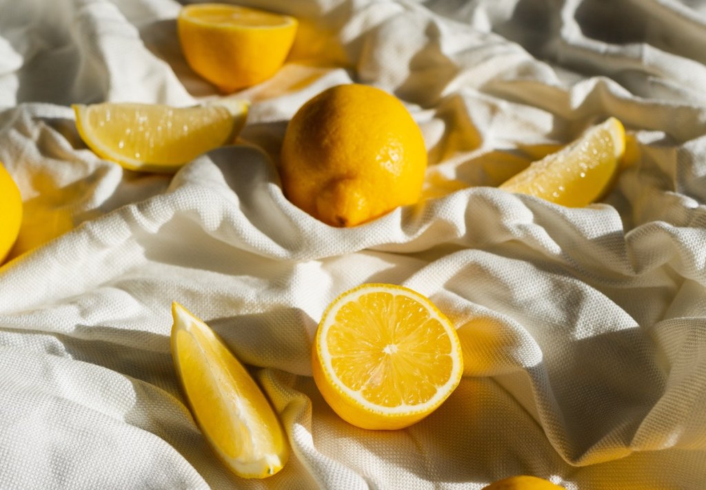 sliced lemons on white blanket
