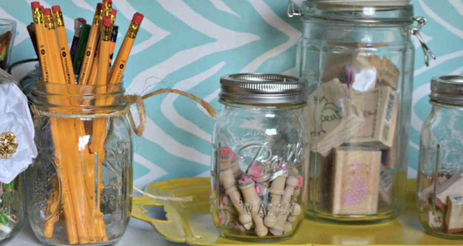 mason jars with pencils and erasers inside
