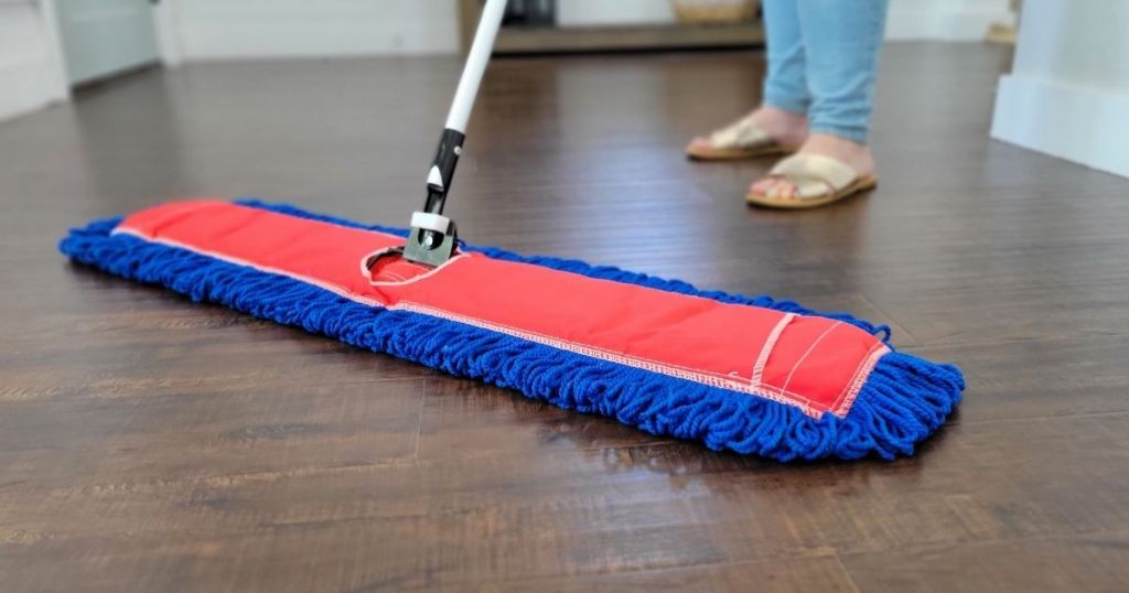 person using large microfiber mop