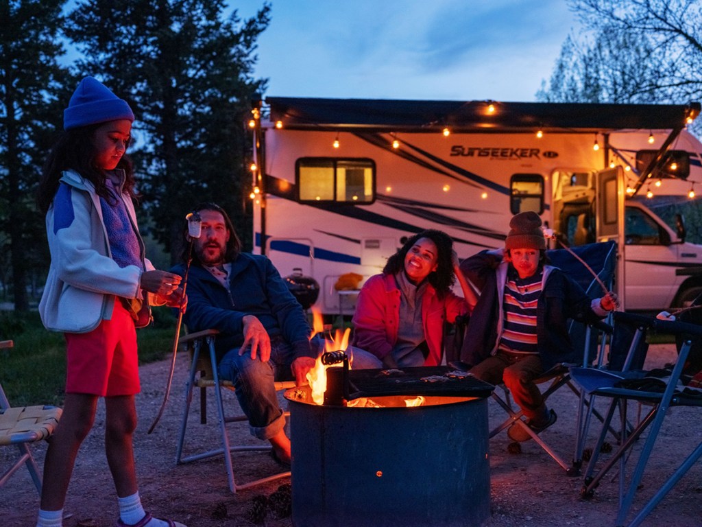 family camping outside with rv from rvshare